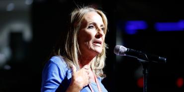 Debbie White, president of New Jersey’s Health Professionals and Allied Employees, speaks at a microphone during the collective bargaining session at the AFT’s national convention.